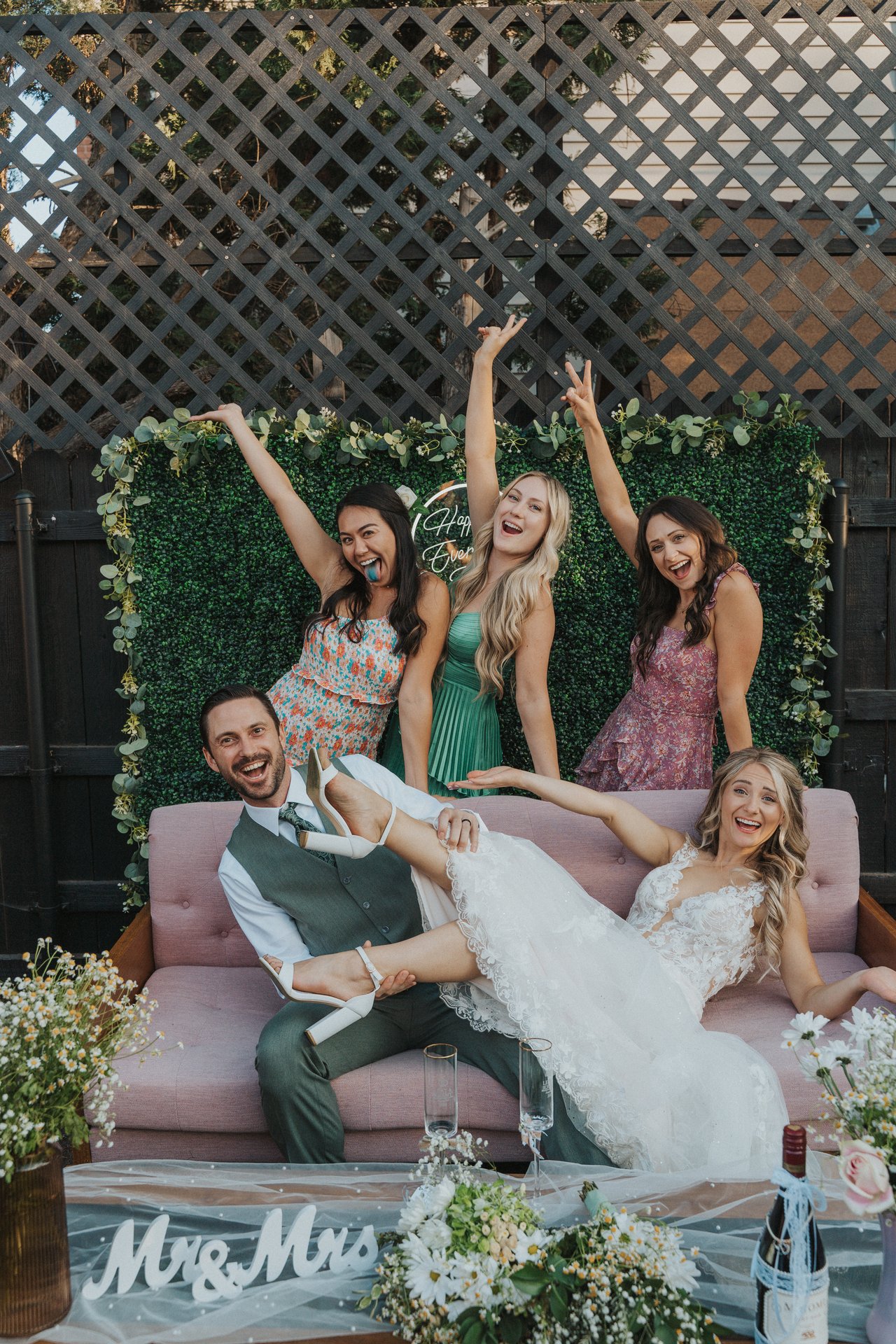 Lexy and her friends throwing their arms up at the couch