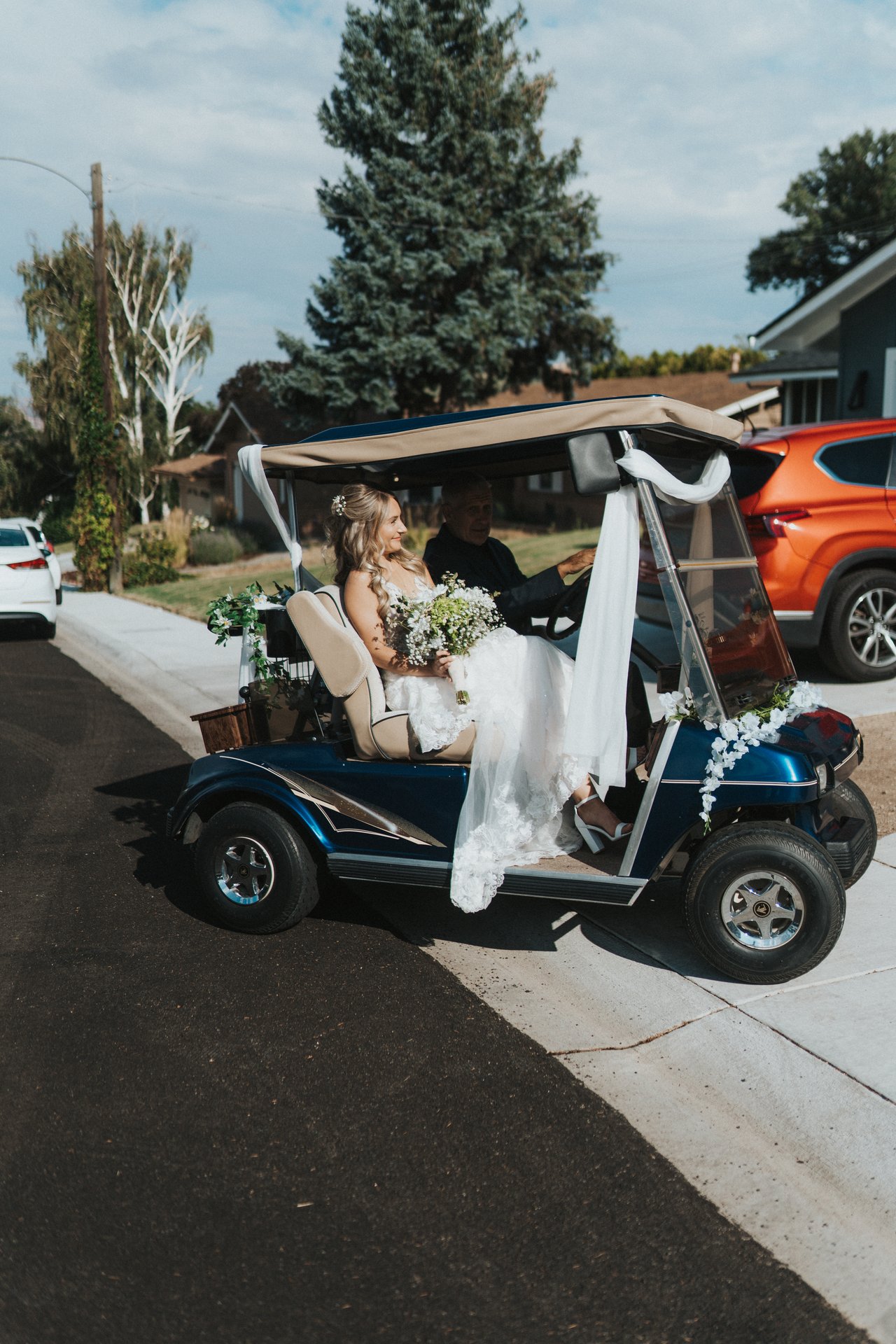 The golf cart carrying Lexy pulls up to the house