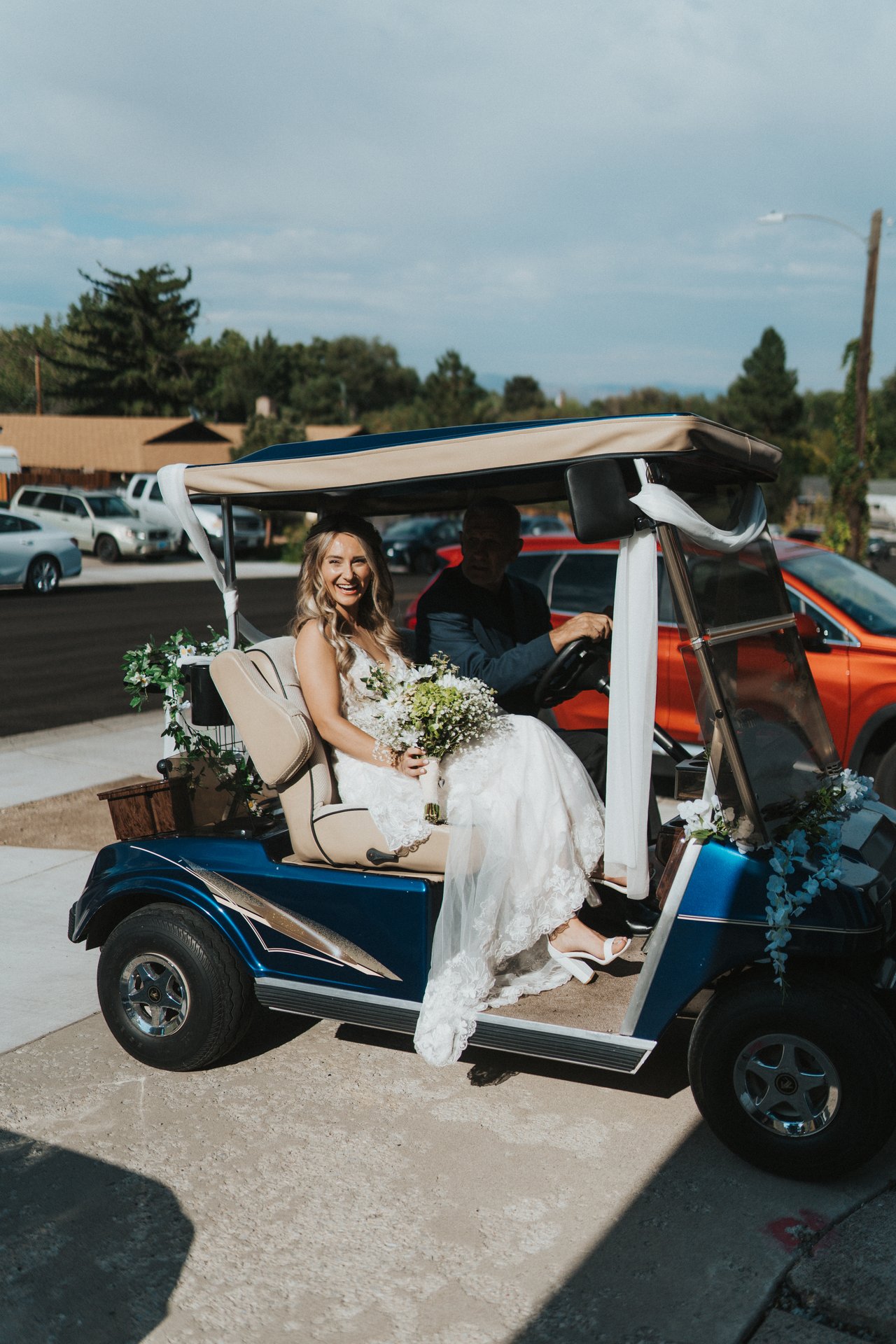Lexy smiling in the golf cart