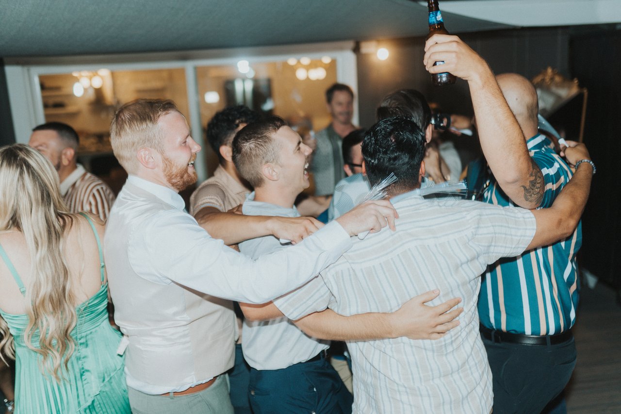 Friends in a group hug on the dance floor