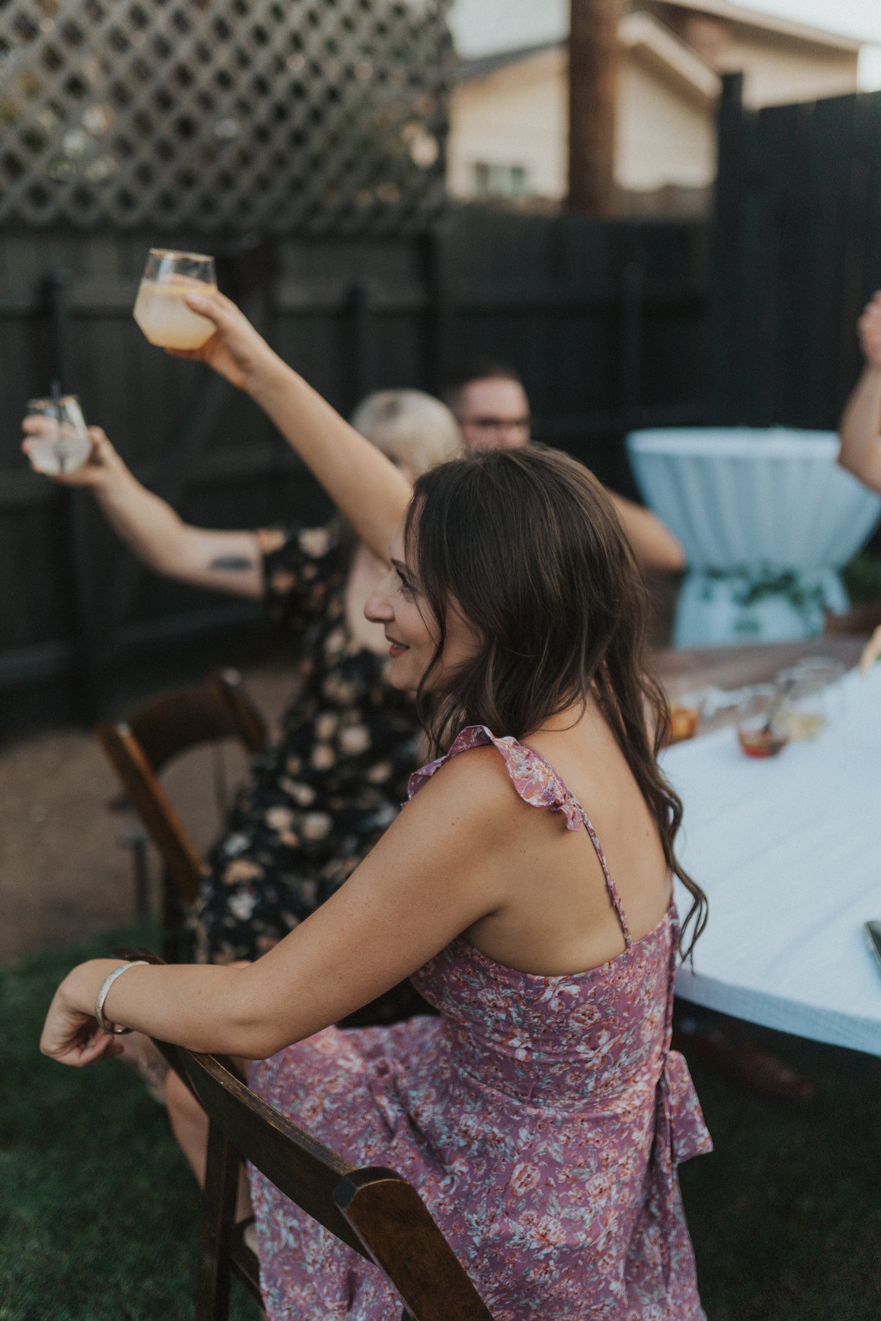A guest raises her glass during the toasts
