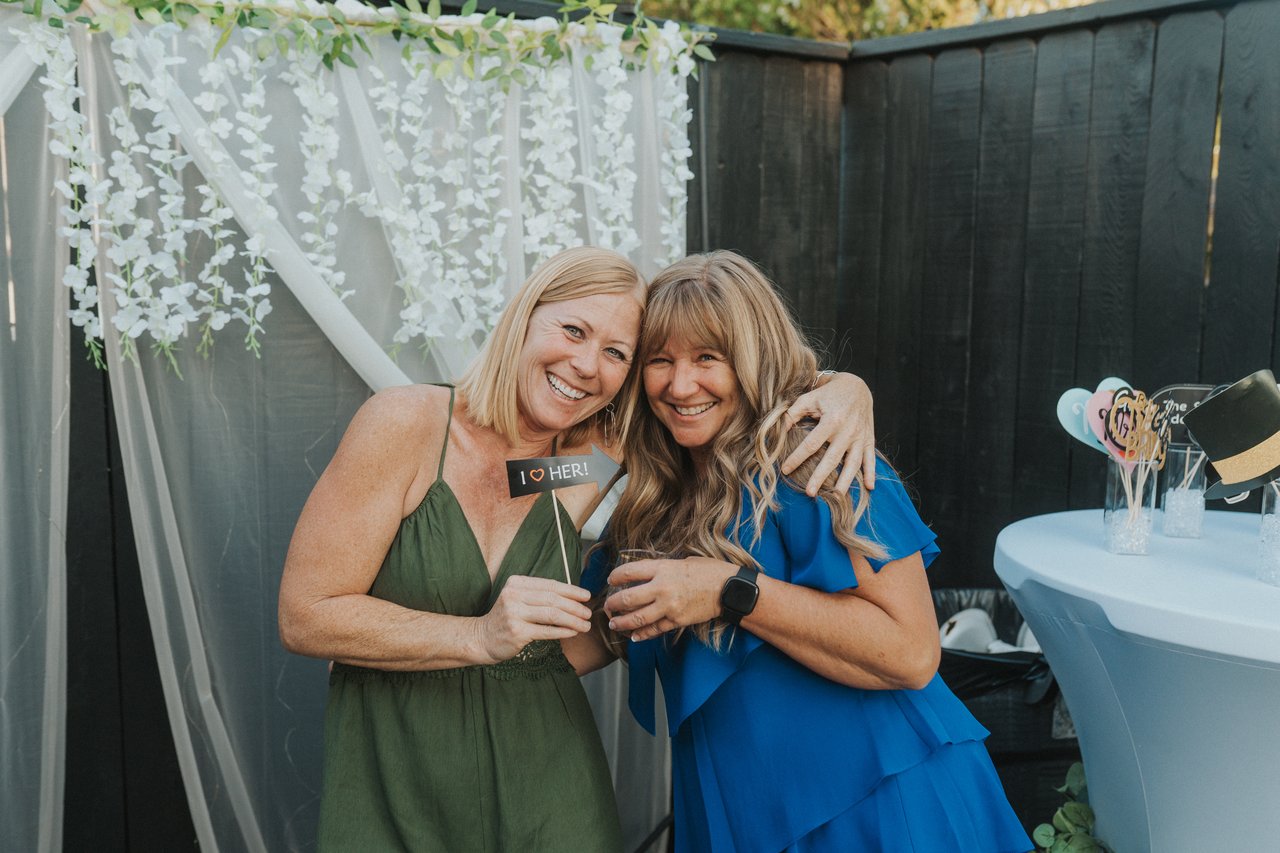 Lexy's mom hugs a guest at the reception