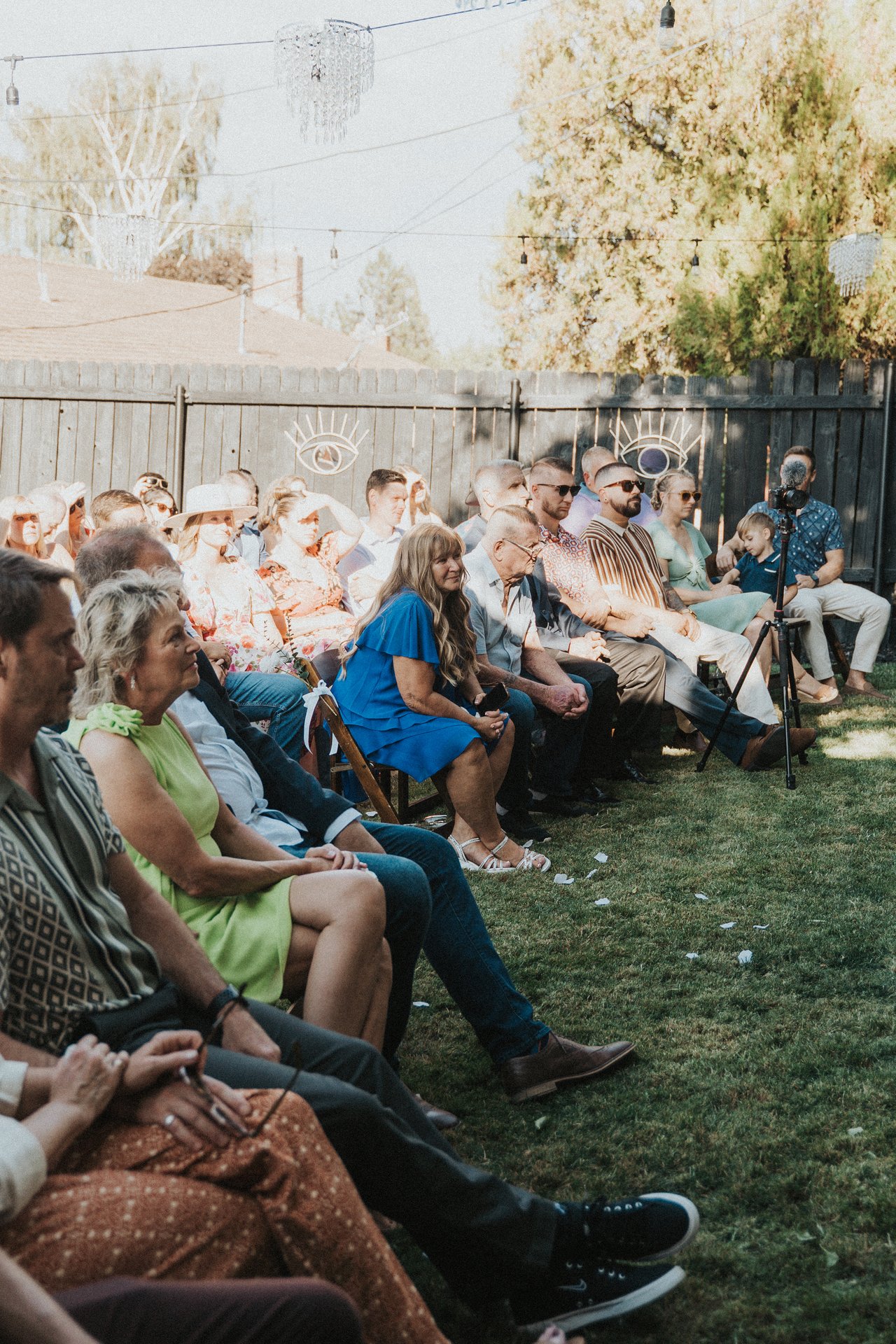 Guests seated in the backyard during the ceremony