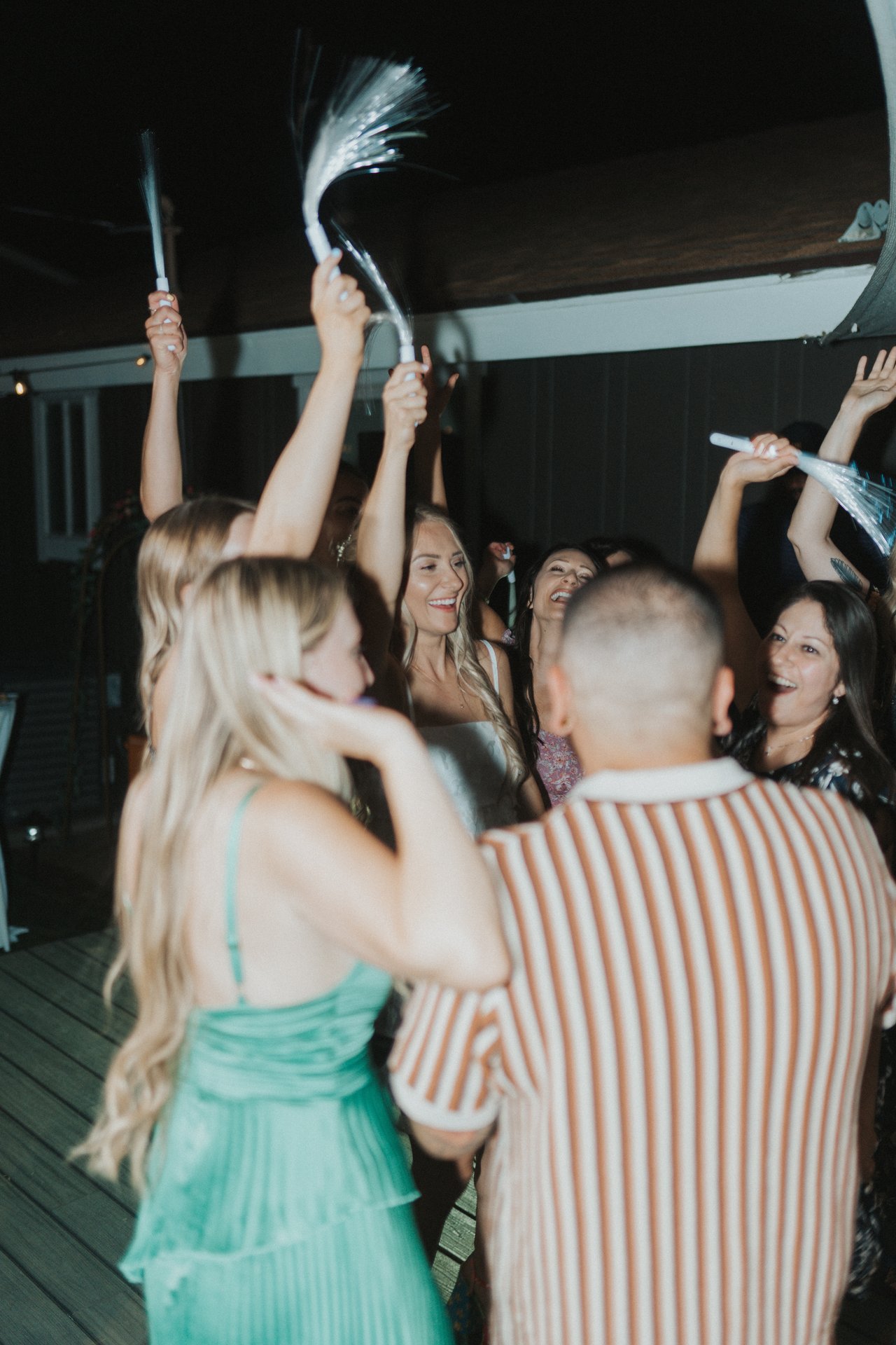 Guests waving light up wands
