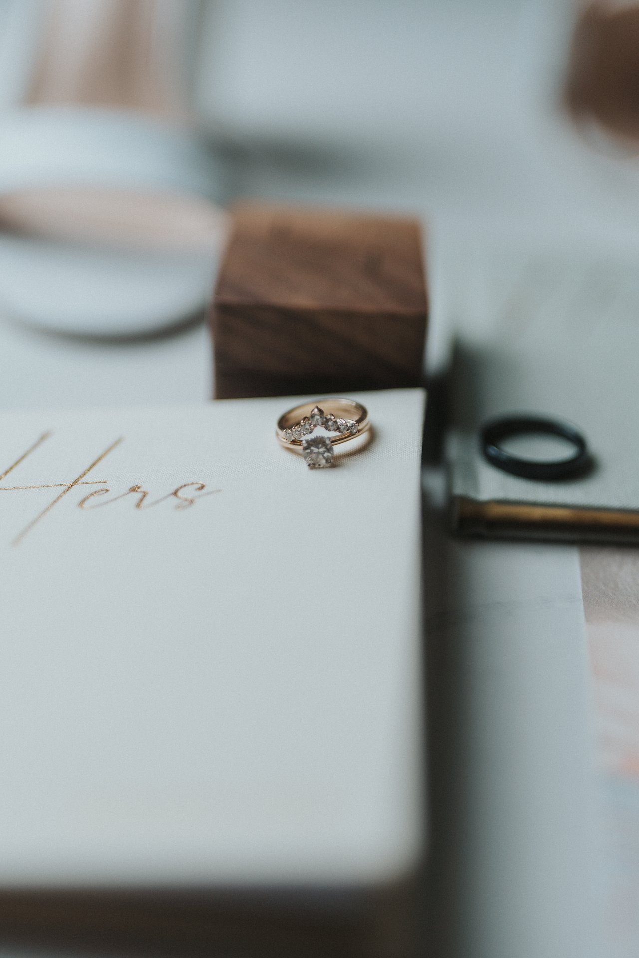 The Hers vow book with her engagement ring
