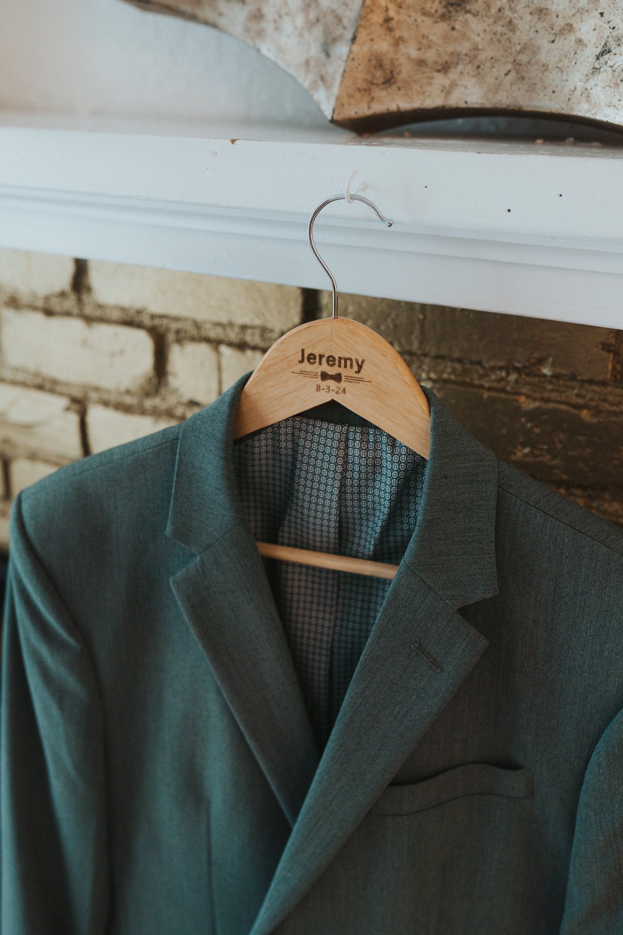 Jeremy's jacket on a hanger with his name on it