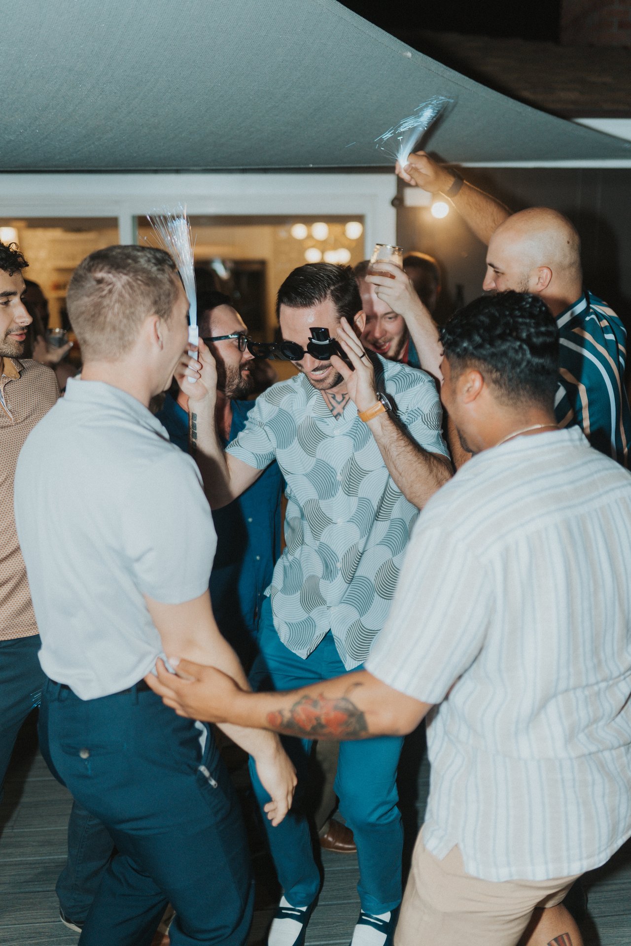 Jeremy surrounded by friends on the dance floor