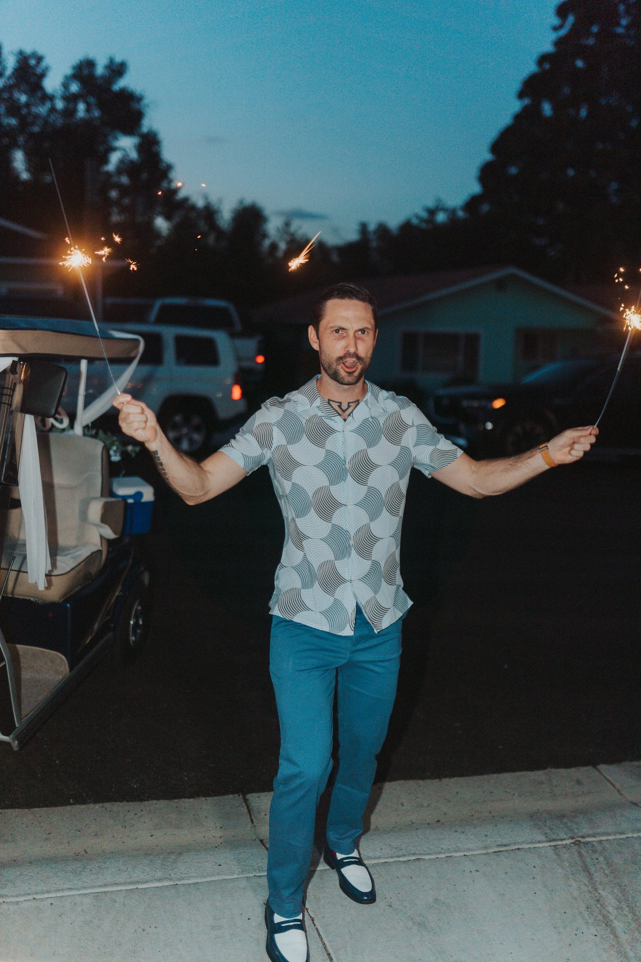 Jeremy holding sparklers at the send off