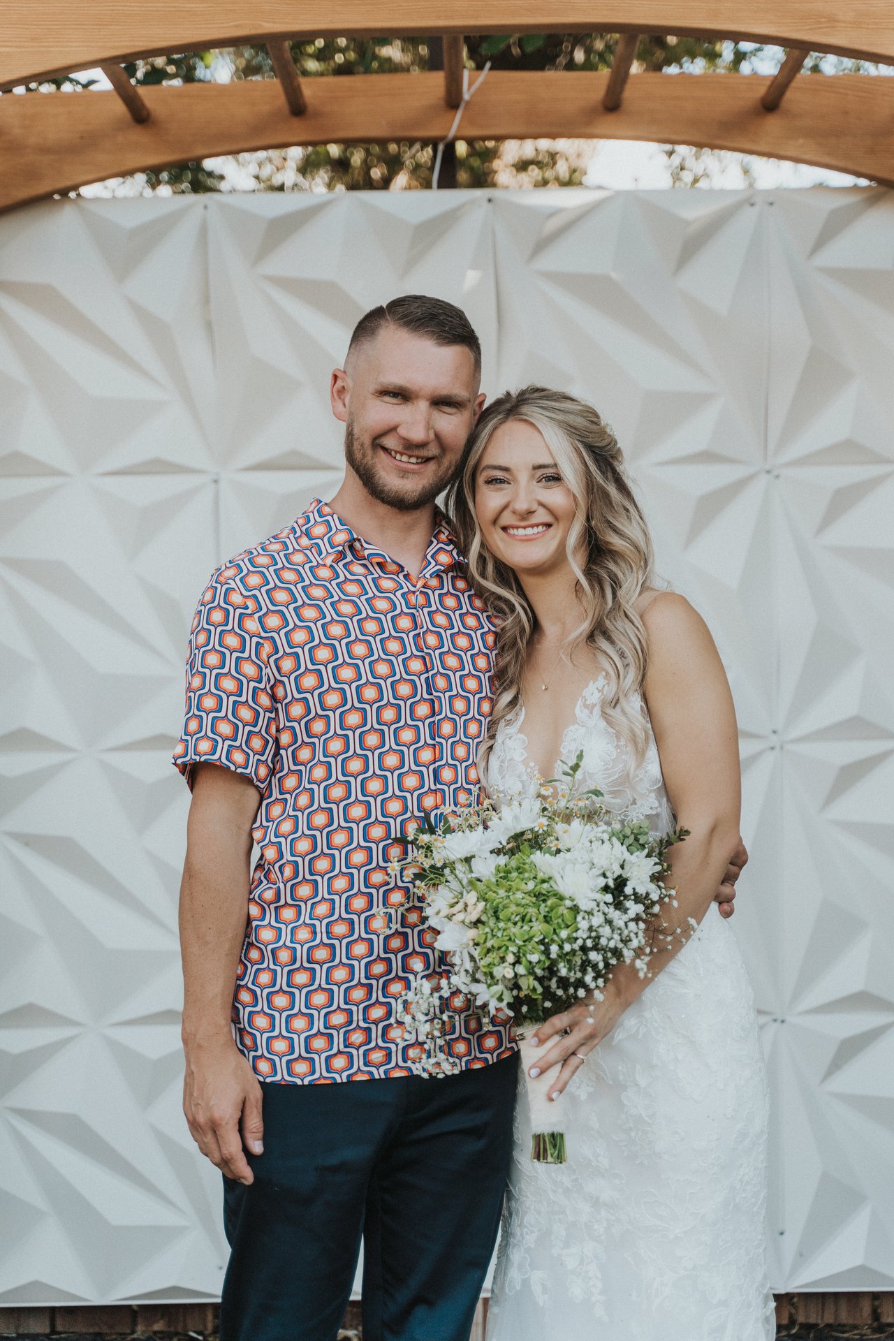 Lexy with a family member in a patterned shirt