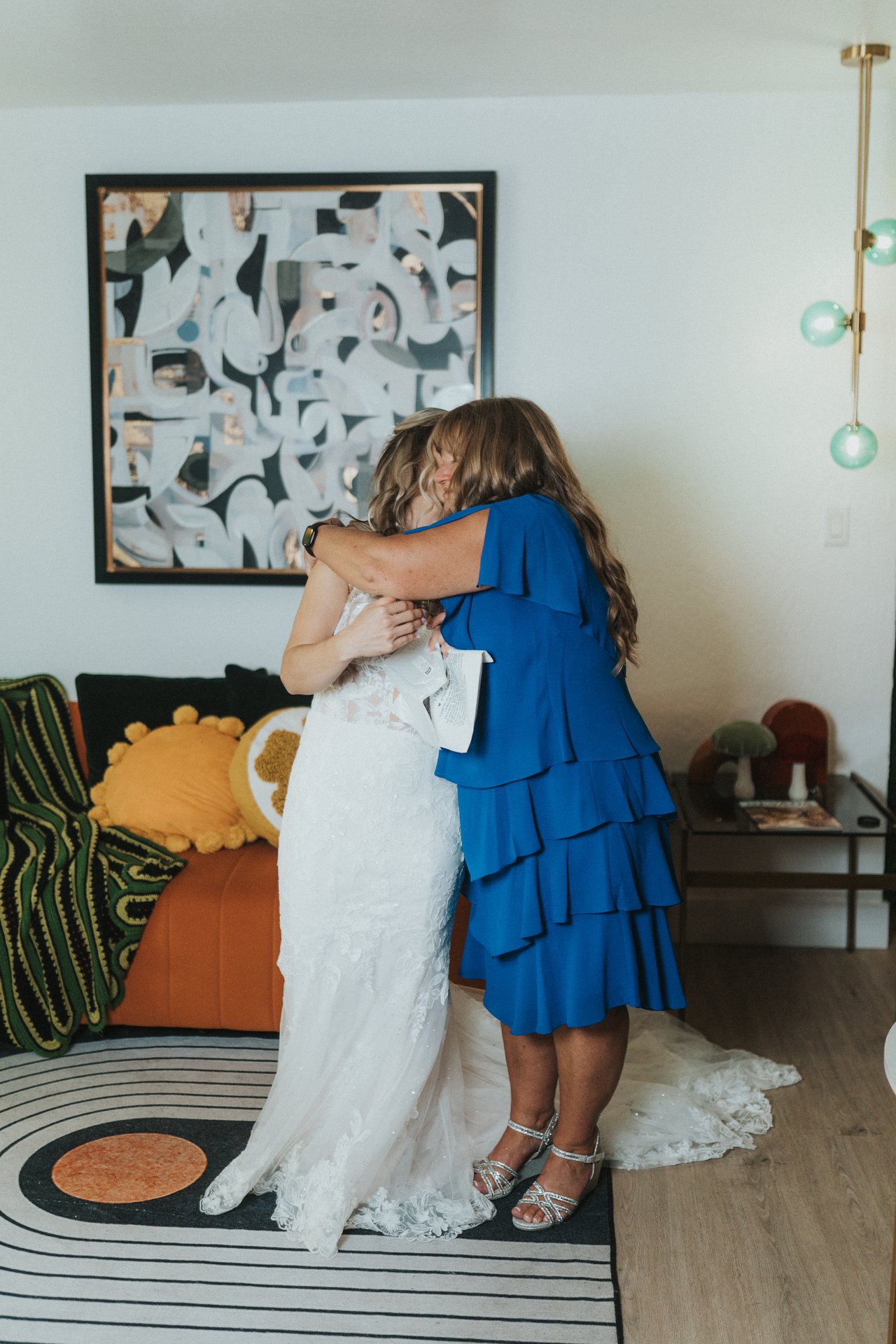 Lexy and her mom share a long hug in the living room