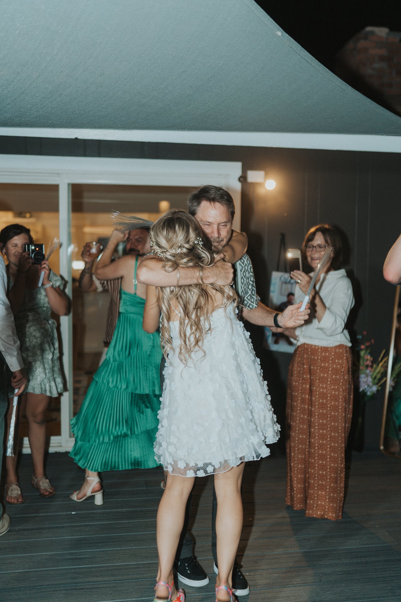 Lexy hugging a guest on the dance floor
