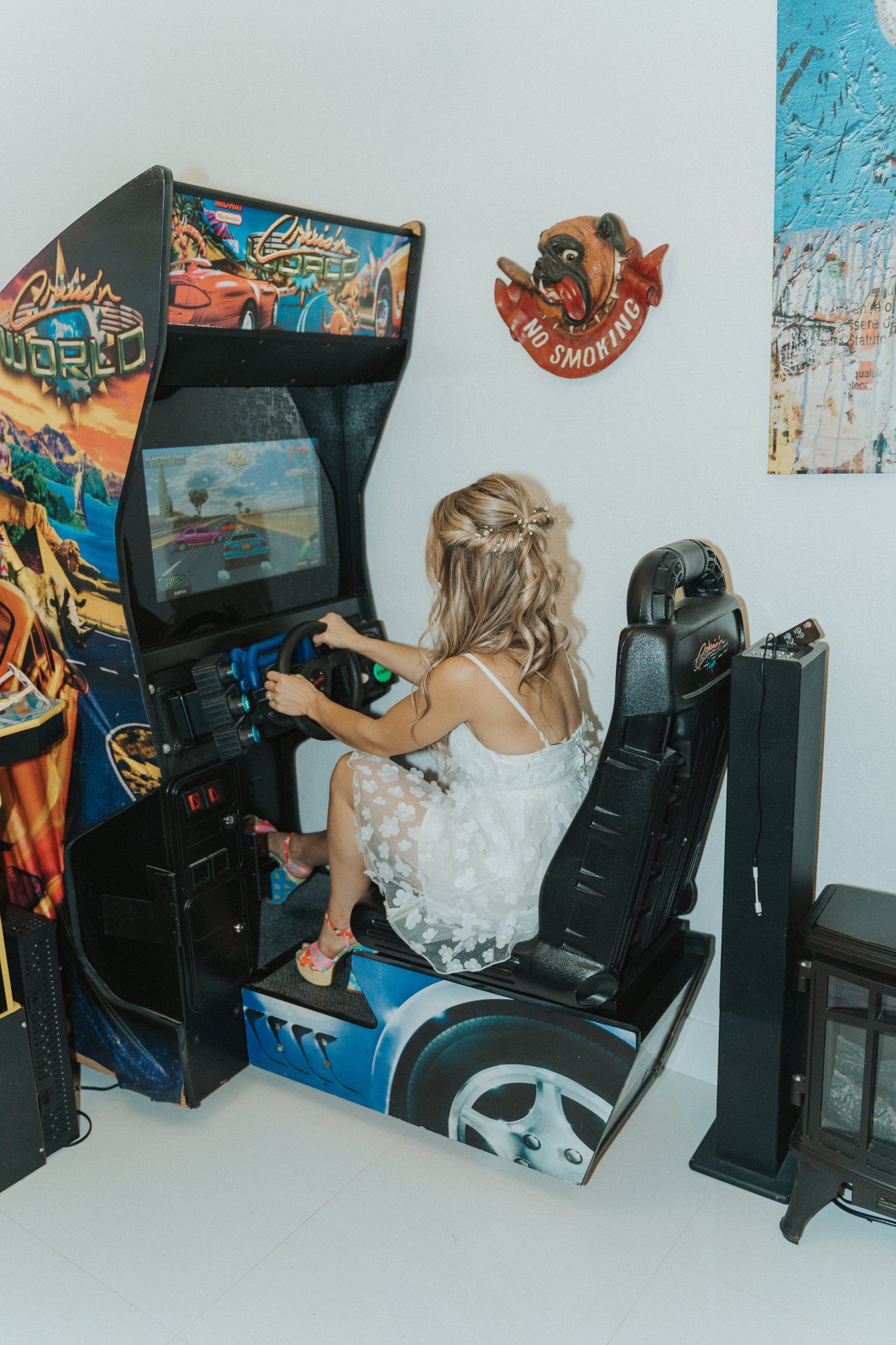Lexy on the racing game in the arcade room