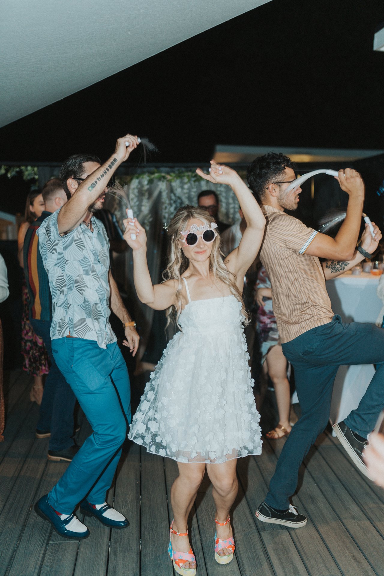 Lexy dancing in white sunglasses