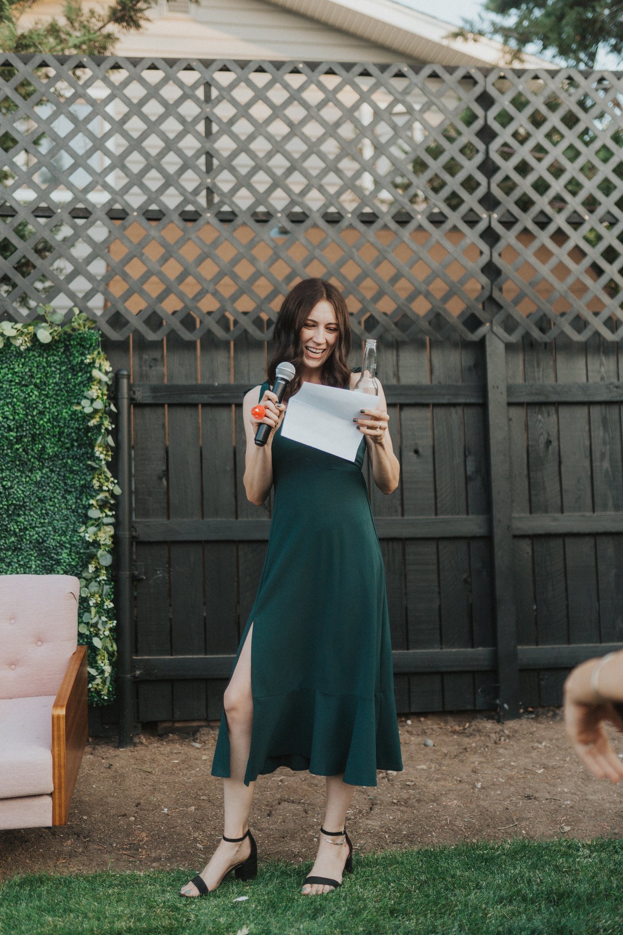 A bridesmaid reads her toast