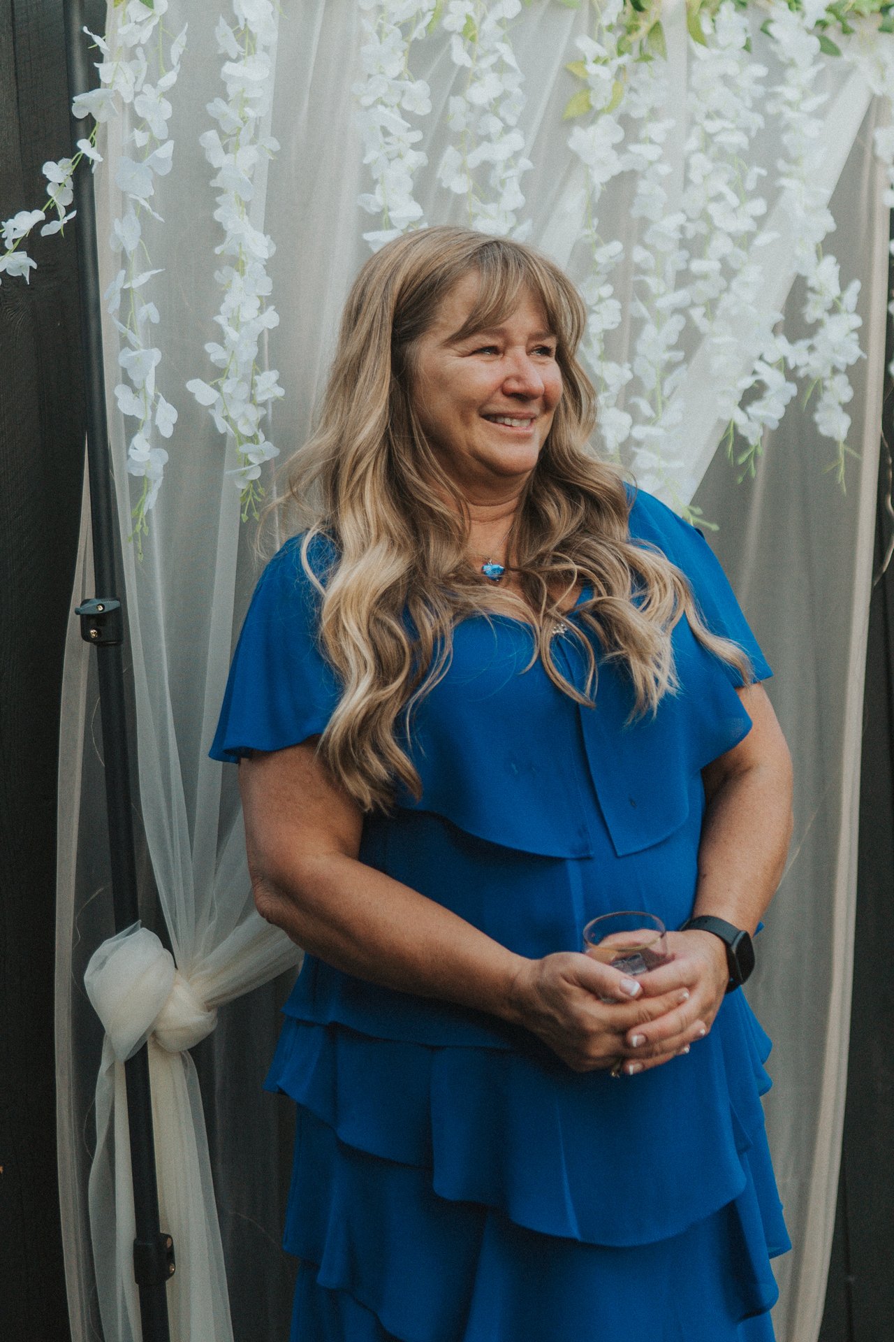 Lexy's mom smiling as she watches the dance