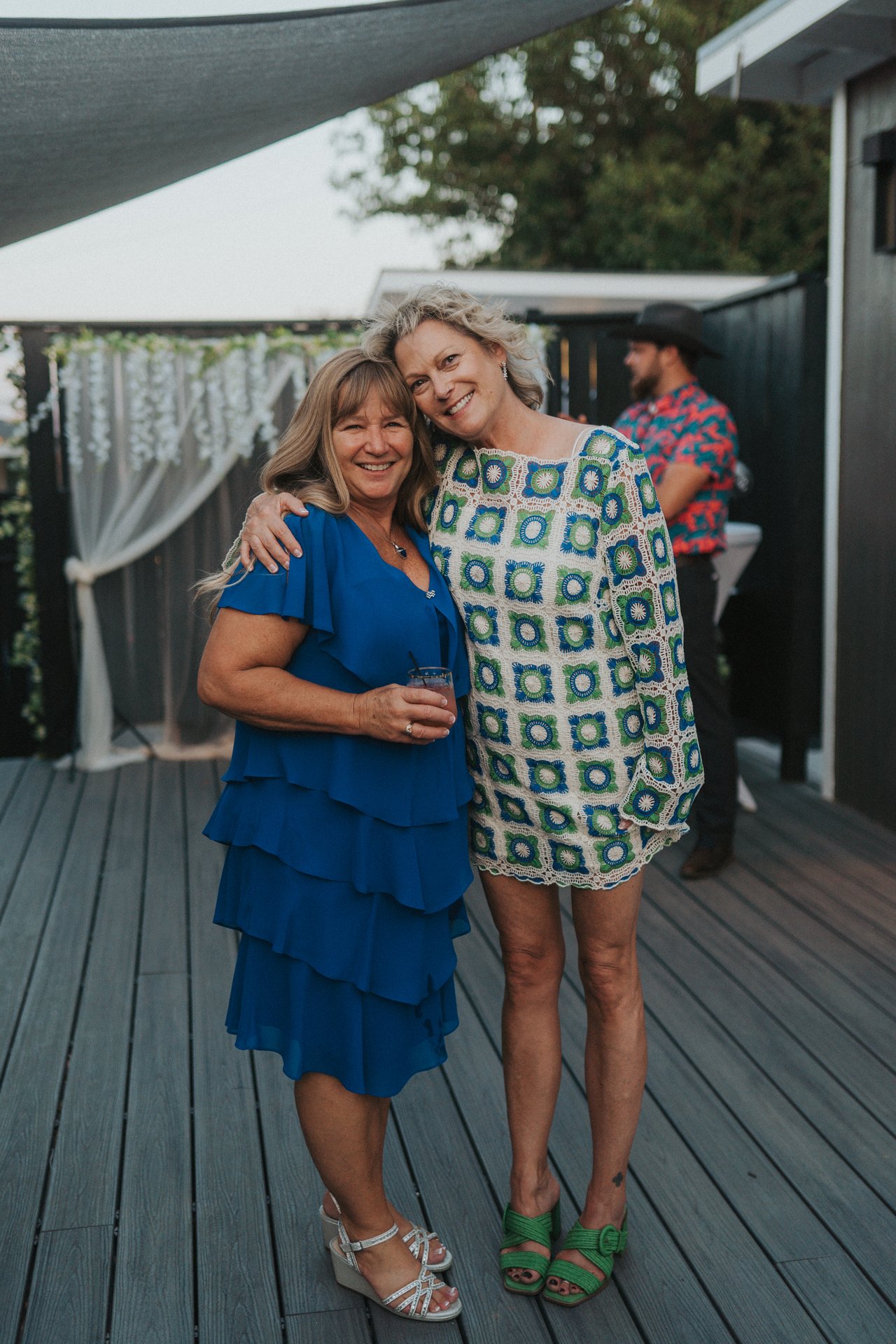 Lexy's mom with a guest on the deck