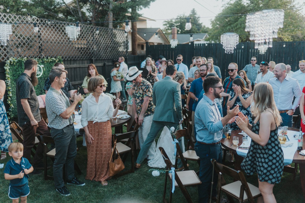 Guests gathered at the backyard reception