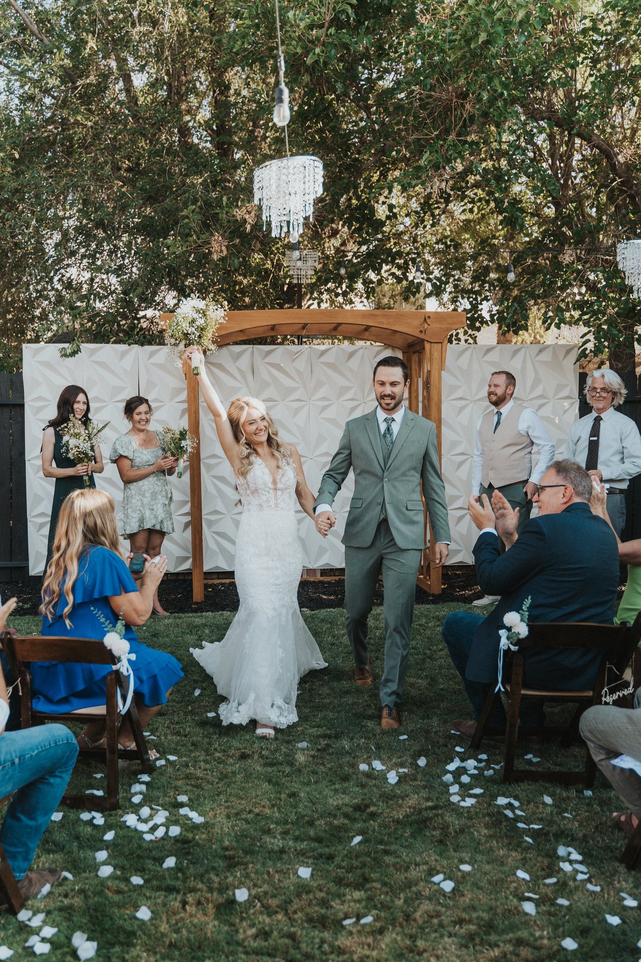 Lexy and Jeremy cheer walking back up the aisle