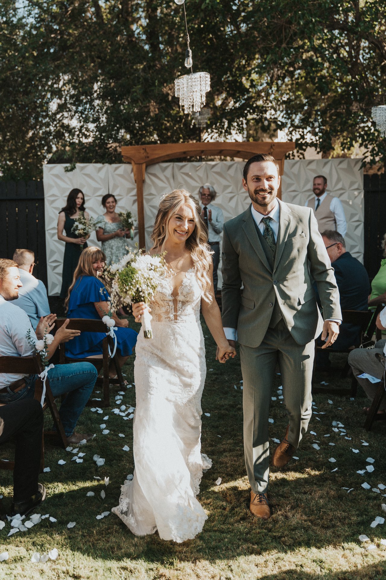 Lexy and Jeremy smiling at the end of the aisle