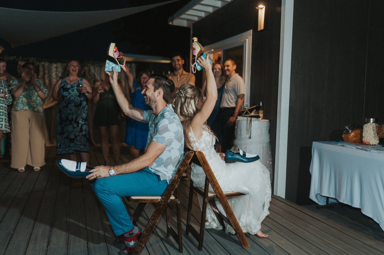 Guests watch as Lexy and Jeremy raise their shoes