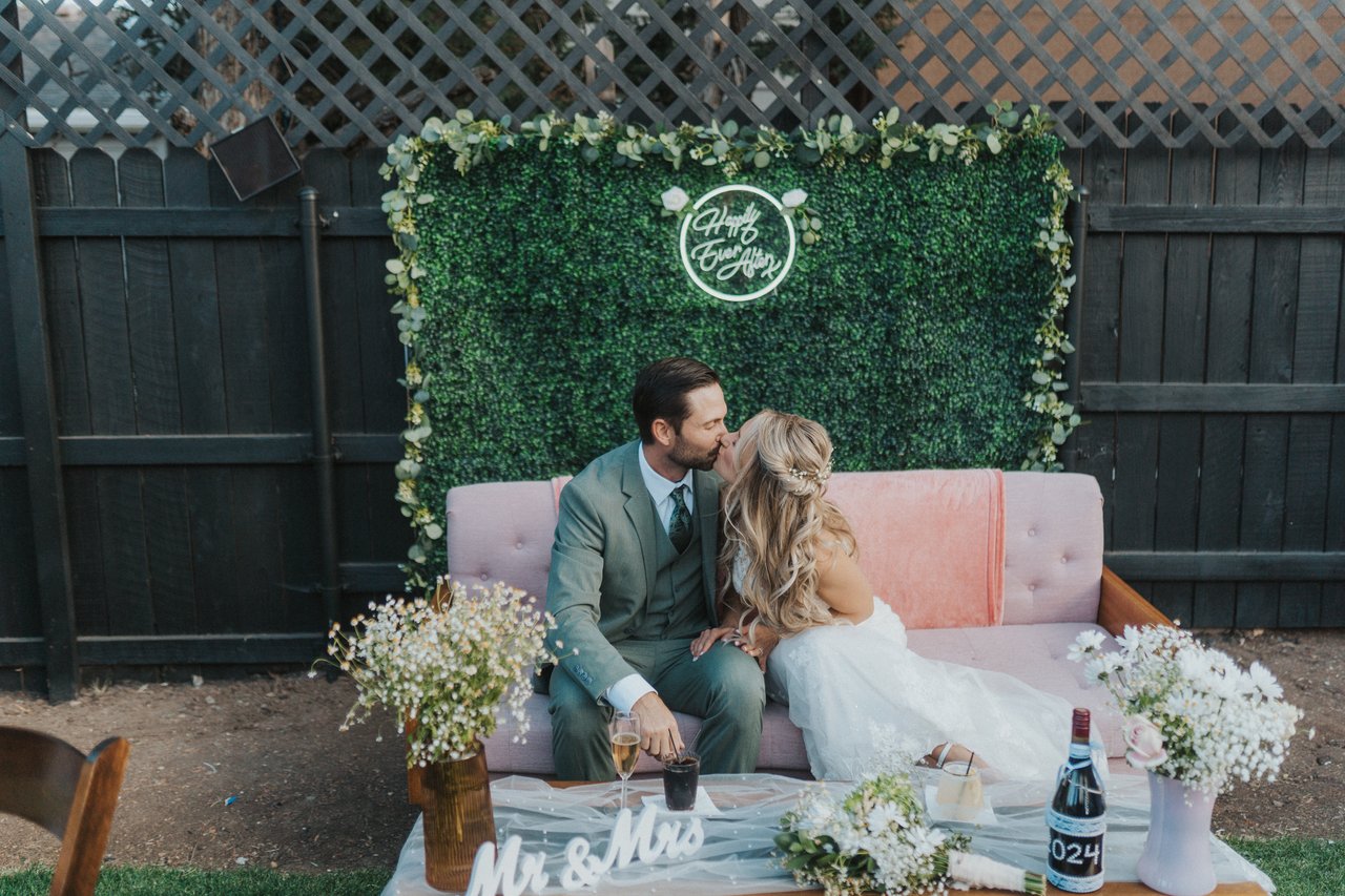Lexy and Jeremy settle onto their pink sweetheart couch