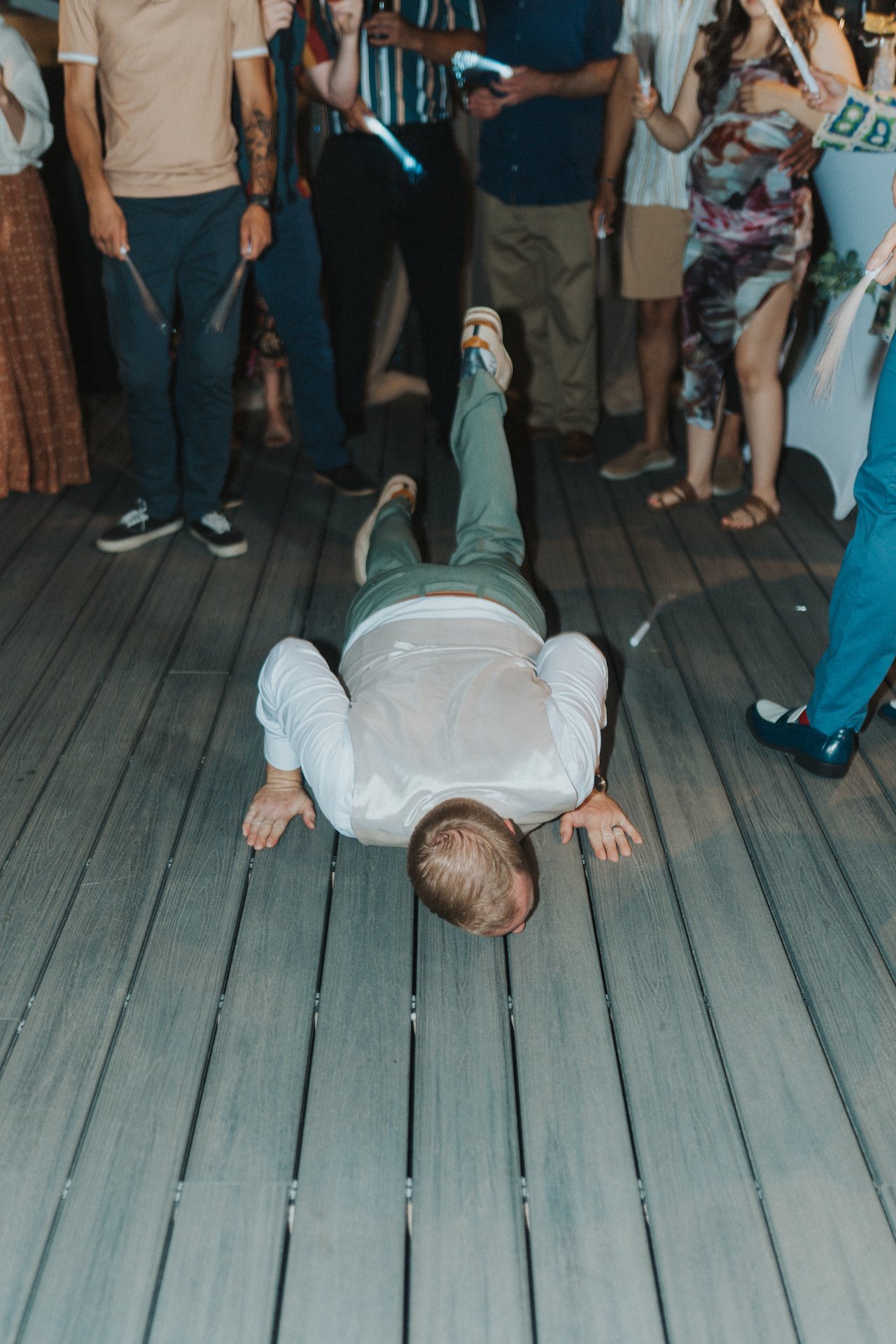 A guest doing the worm on the dance floor