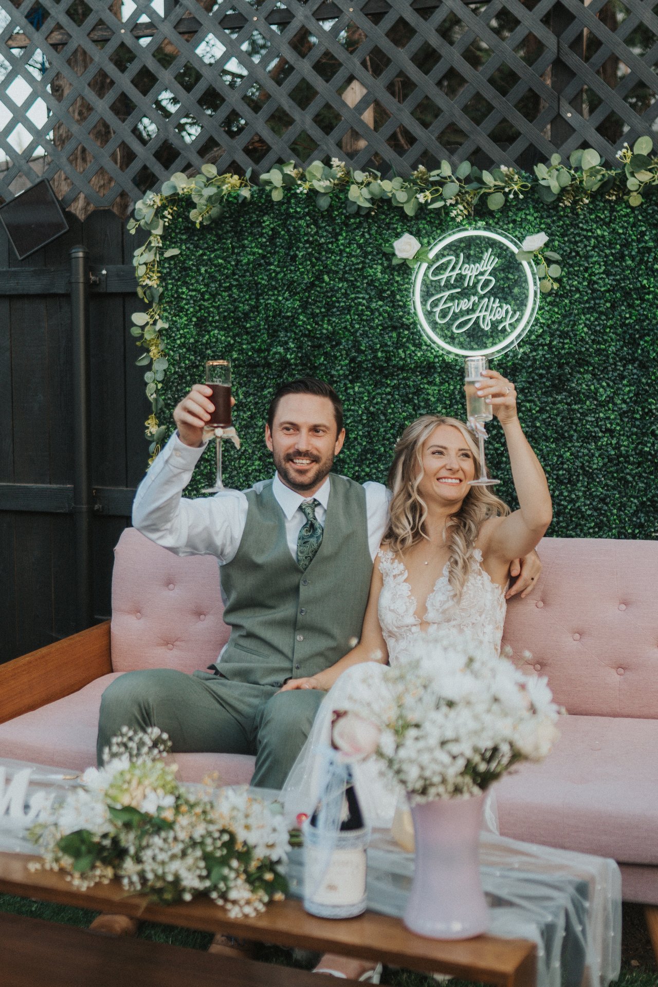 Lexy and Jeremy raise their glasses after a toast