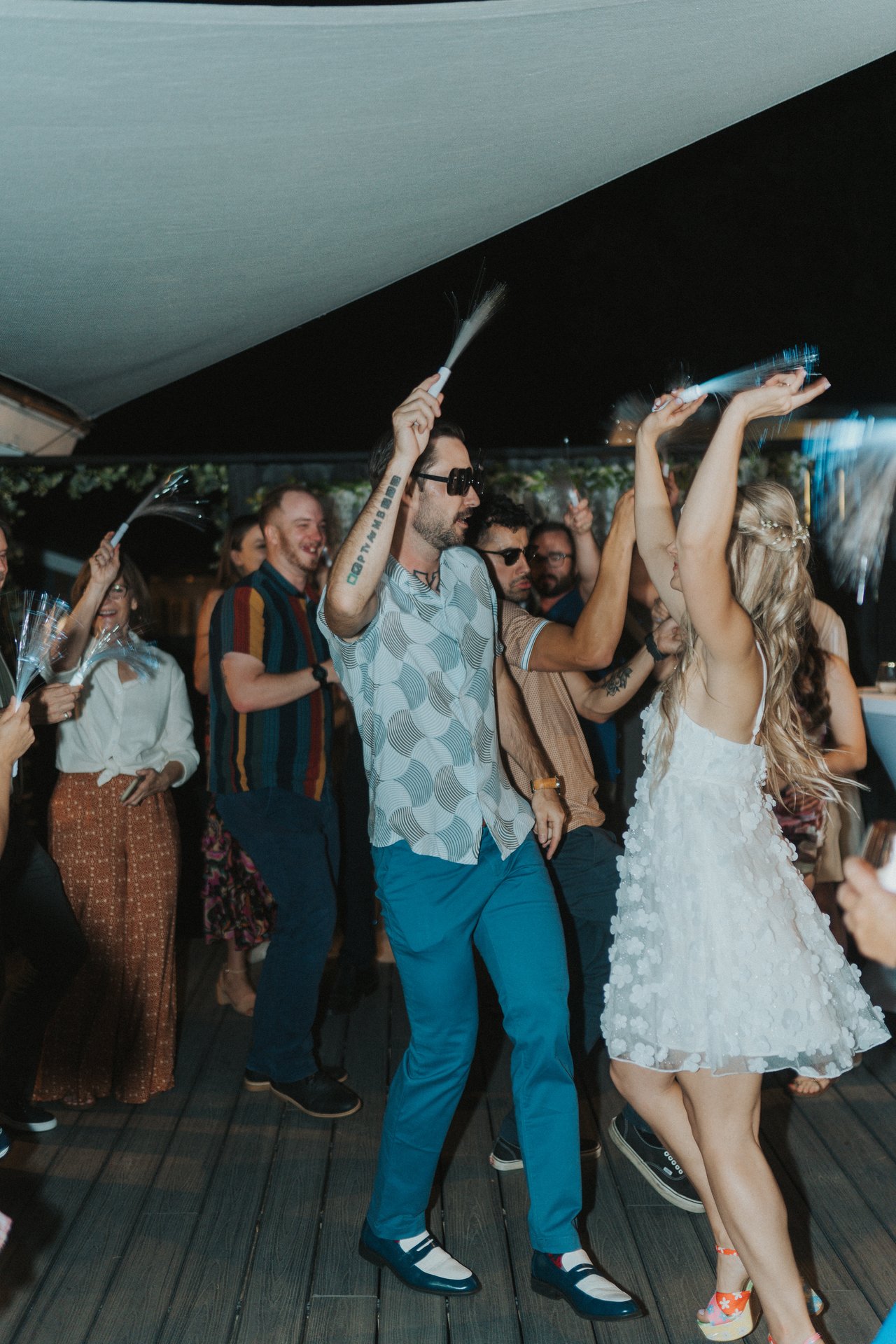 Lexy and Jeremy waving light up wands