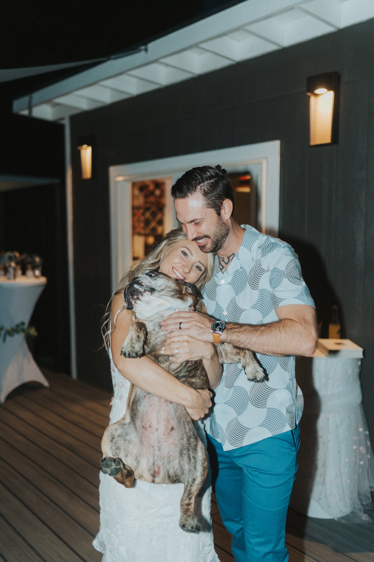 Lexy and Jeremy cuddle their bulldog