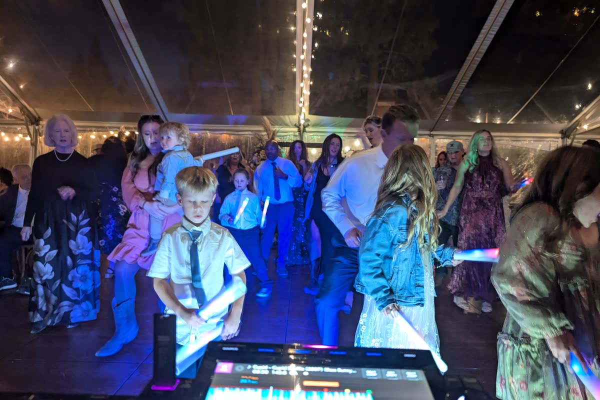 Kids and guests filling the dance floor under the lights at Chalet View Lodge