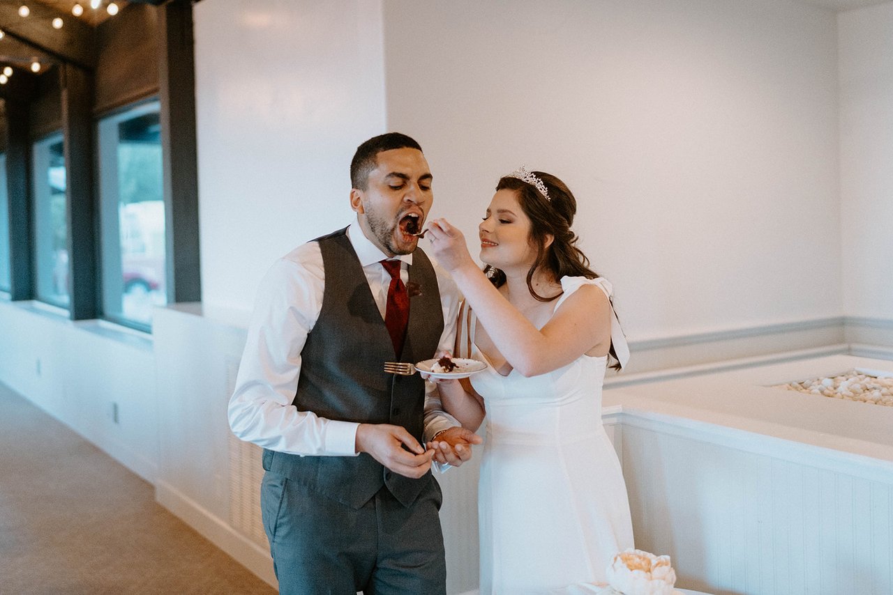 Montse feeds Jason a bite of cake