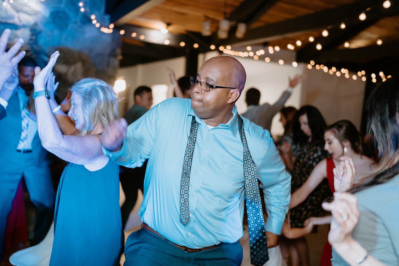 A packed dance floor under the string lights