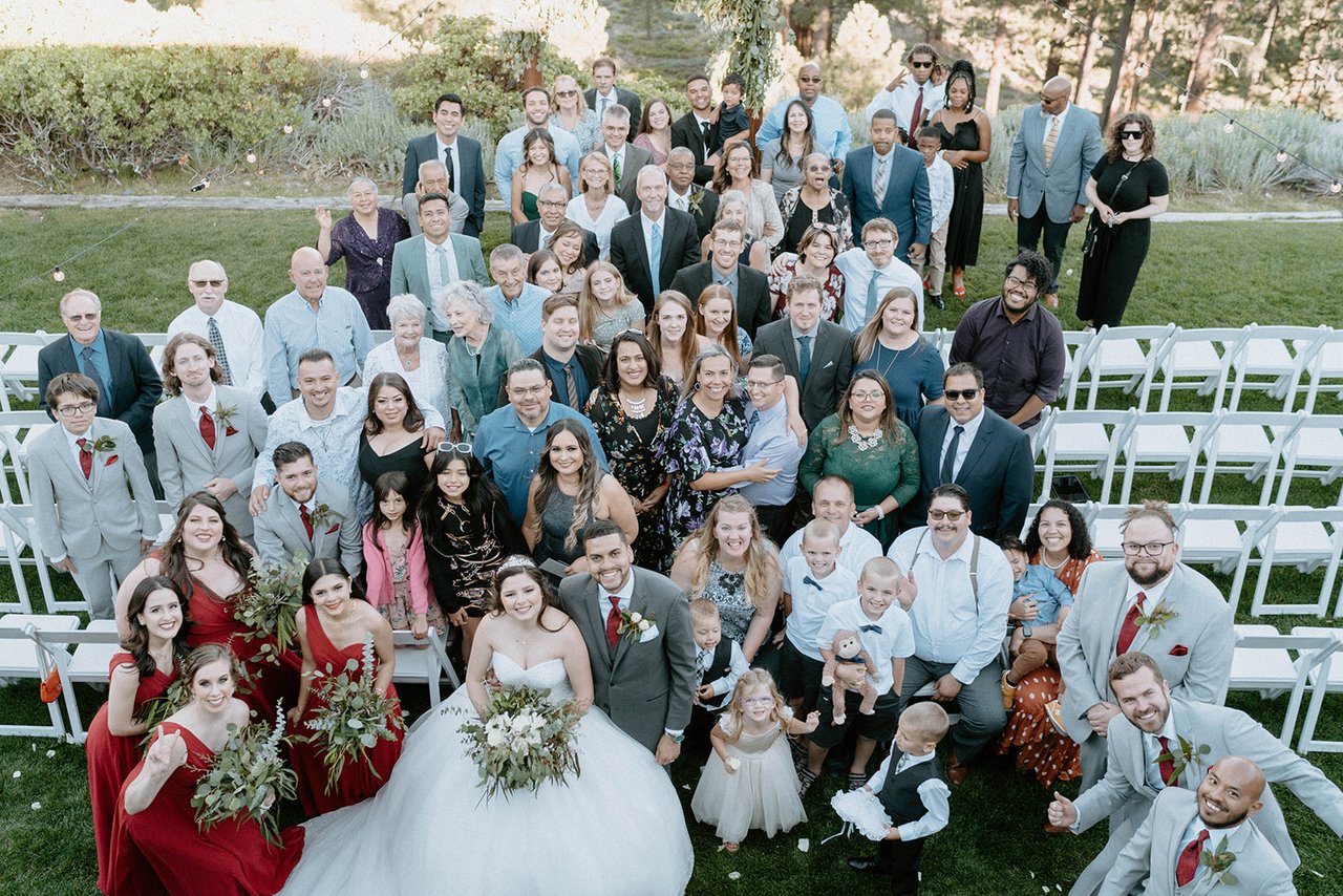 All the guests gathered on the lawn around Montse and Jason, seen from above