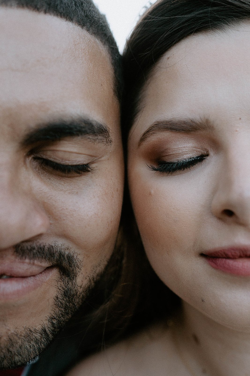 Montse and Jason cheek to cheek with their eyes closed