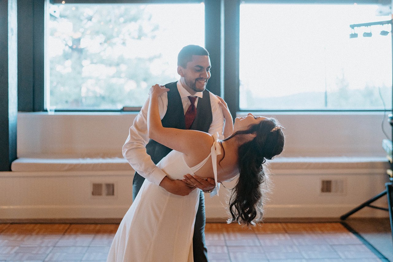 Jason dips Montse in front of the big windows