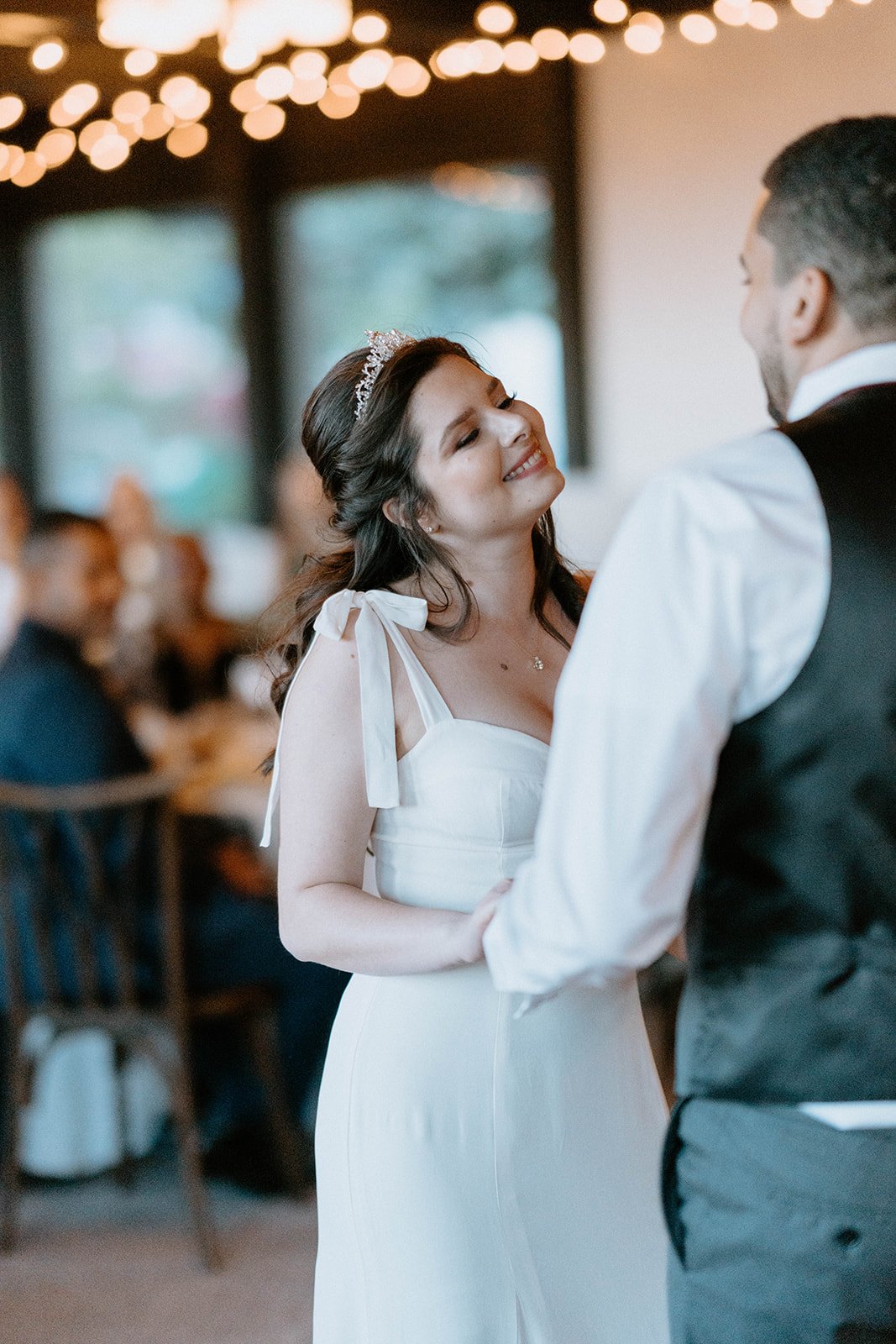 Montse smiles at Jason during their first dance