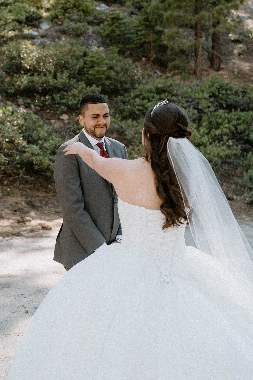 Montse taps Jason on the shoulder for their first look under the pines
