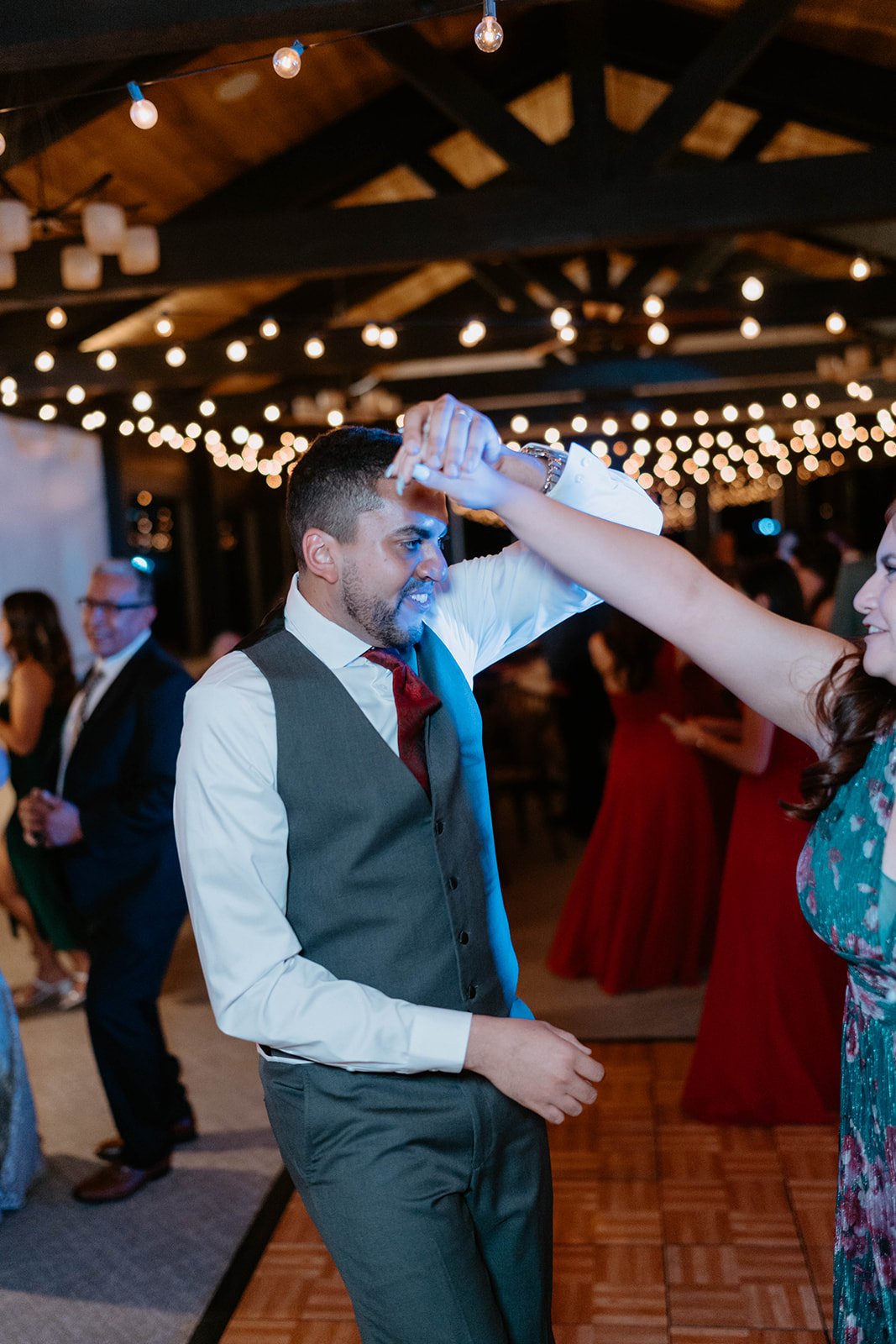 Jason swings a guest around on the dance floor