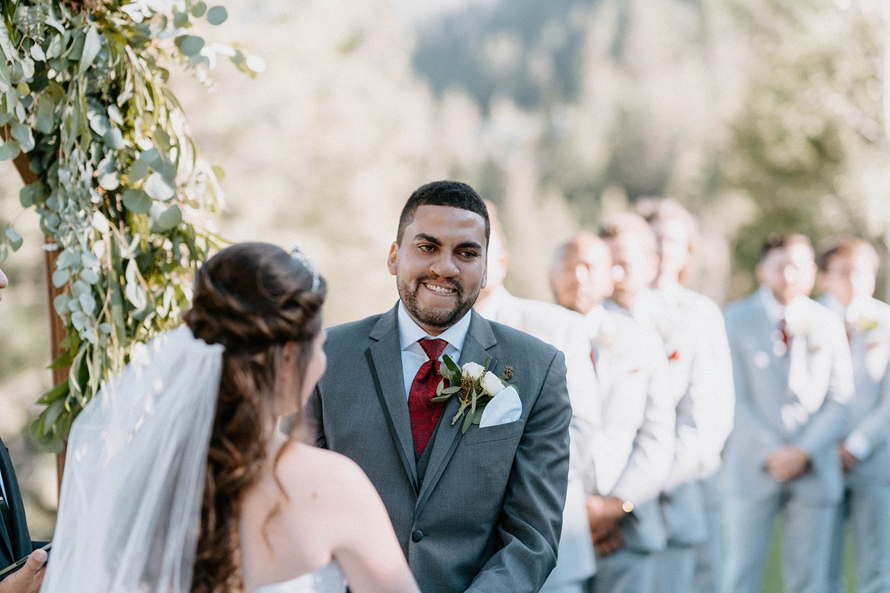 Jason smiles at Montse during the ceremony