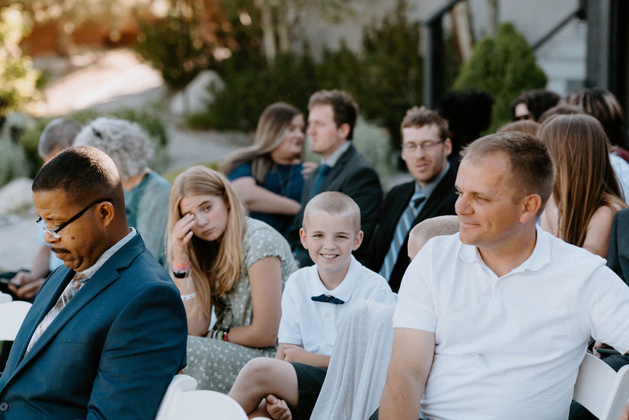 Guests smile in their seats before the ceremony
