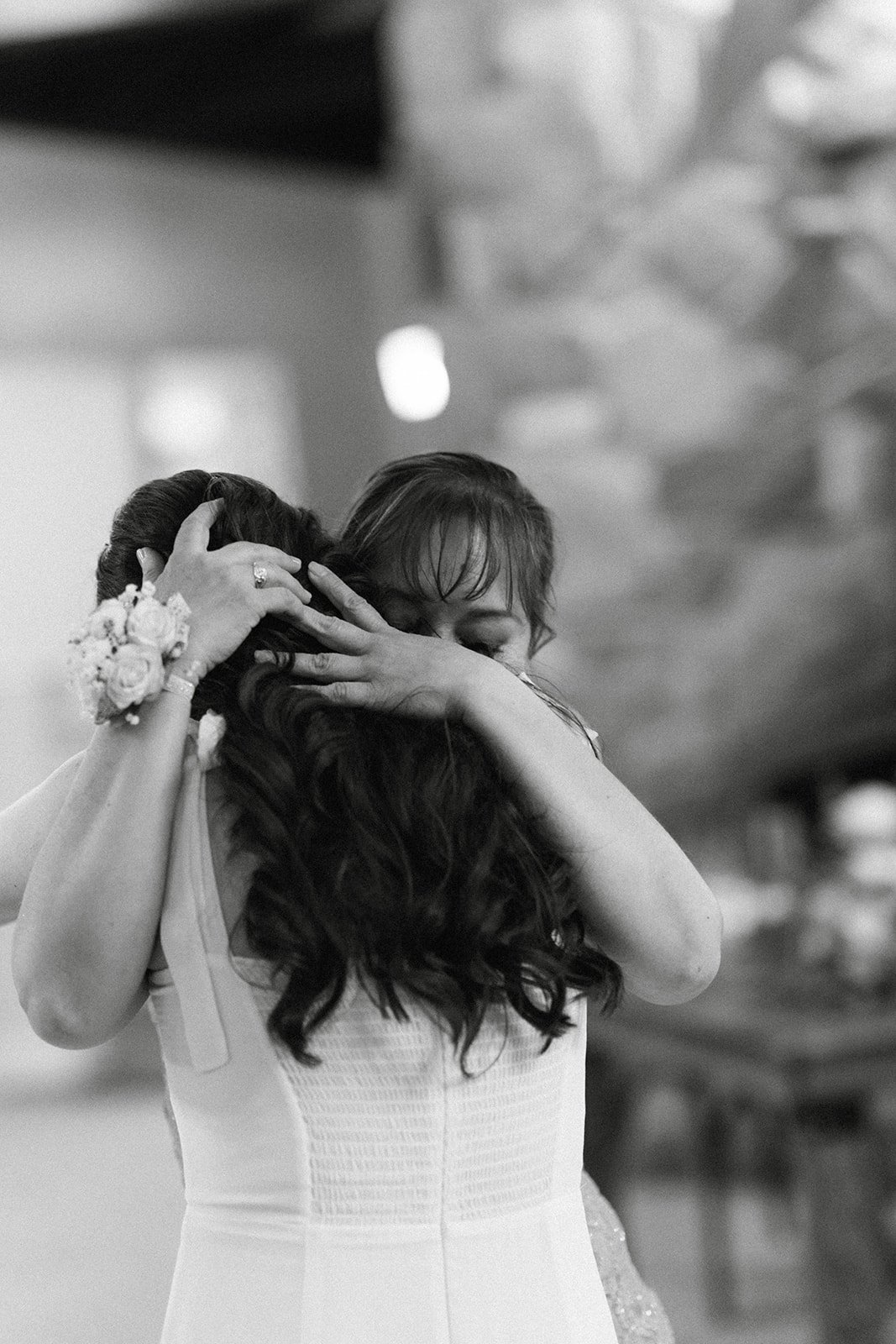 Montse hugs her mom during their dance, in black and white