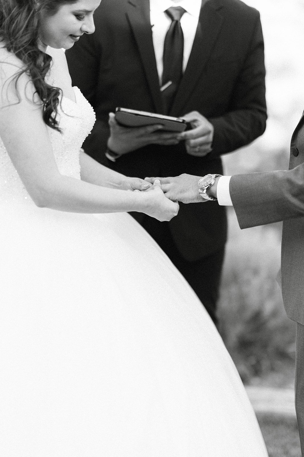 Jason slides the ring onto Montse's finger