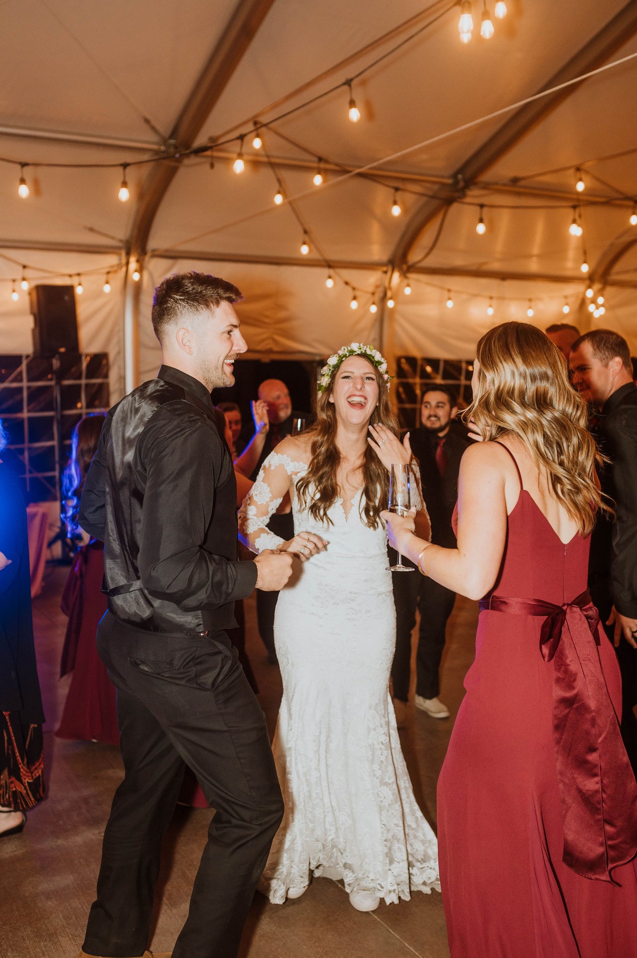 Rachel laughs on the dance floor with her friends