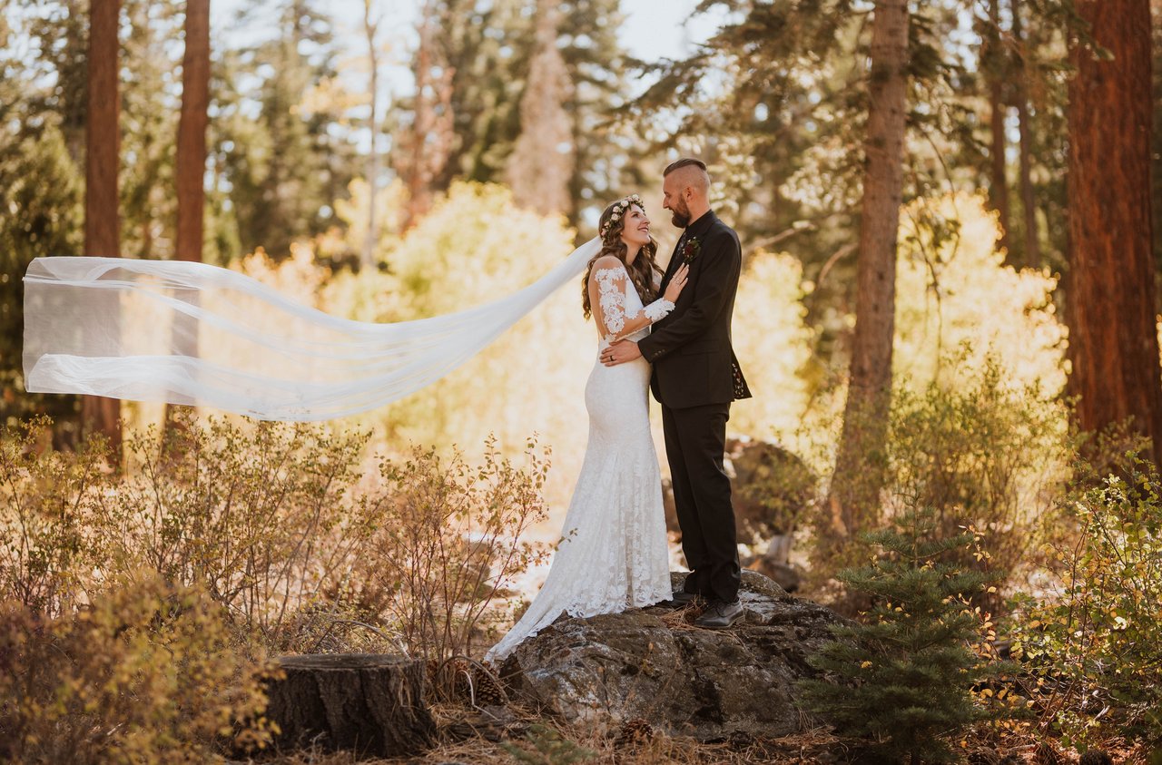 Rachel's veil streams out as she and Christopher kiss in the pines