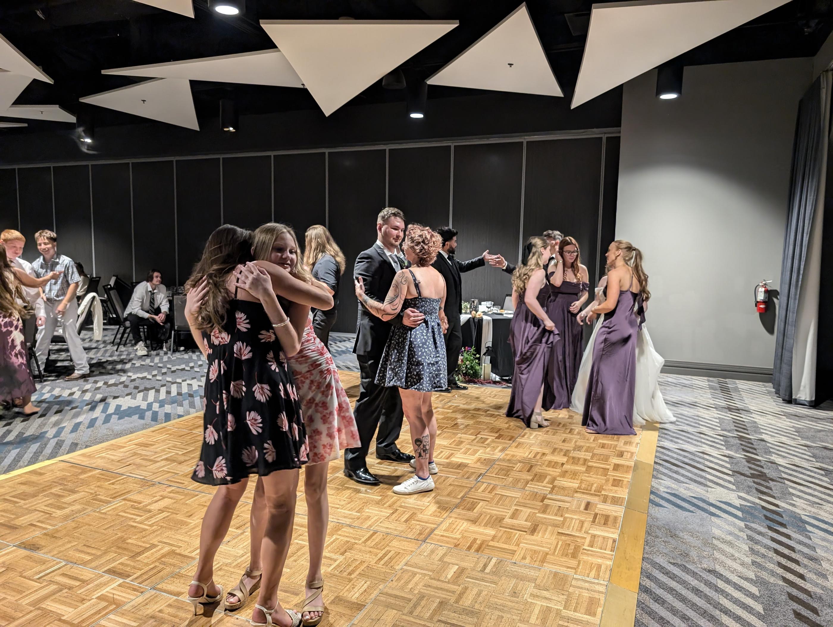Bridesmaids and guests on the dance floor at Hailey and Zen’s reception at the Renaissance Reno