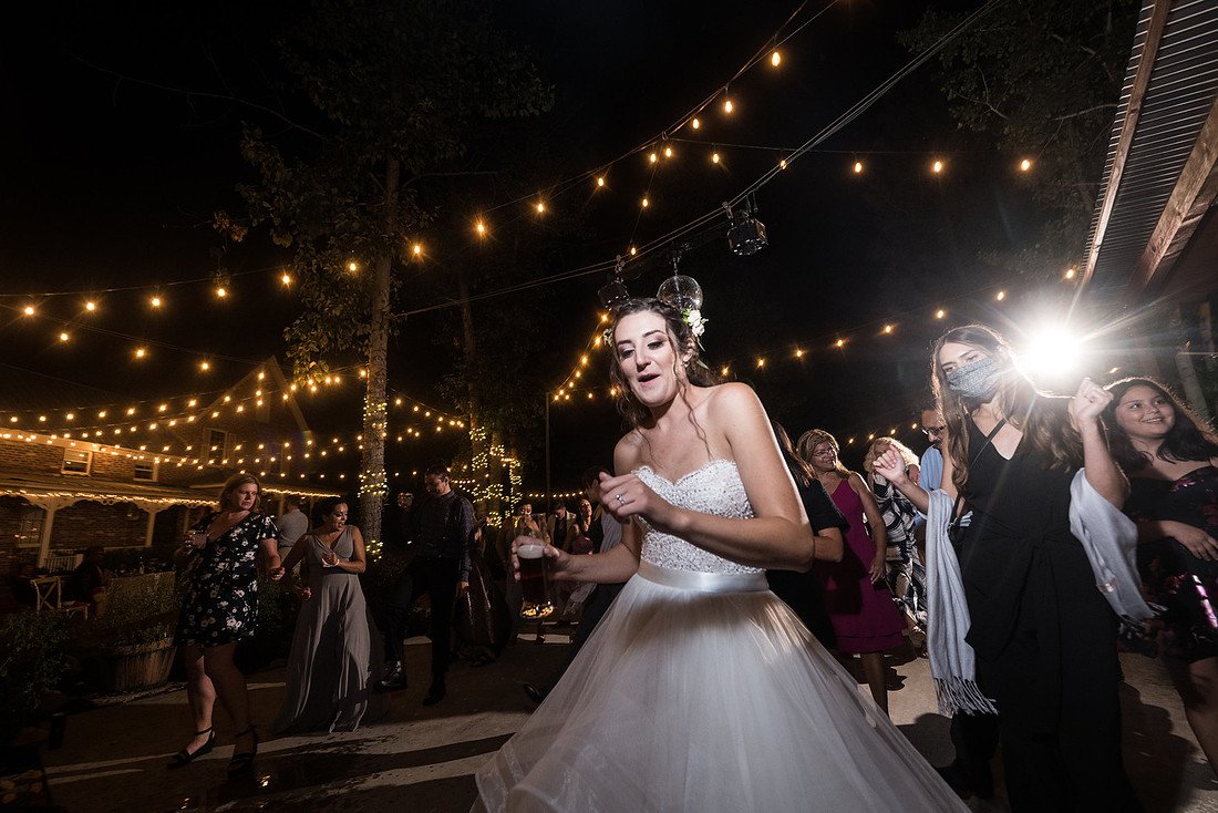 Shannon dances in the middle of a crowded dance floor
