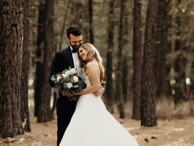 A couple in the forest at Chalet View Lodge near Graeagle, California