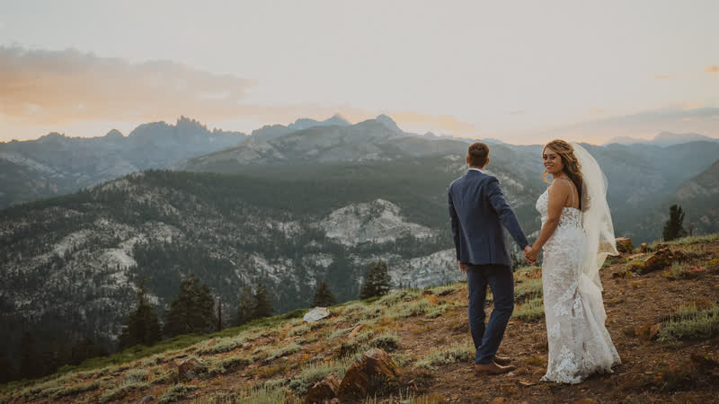 A couple at their mountain-top wedding ceremony at Mammoth Mountain