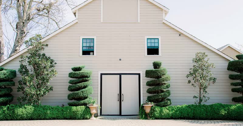 The white event barn at Scribner Bend Vineyards near Sacramento
